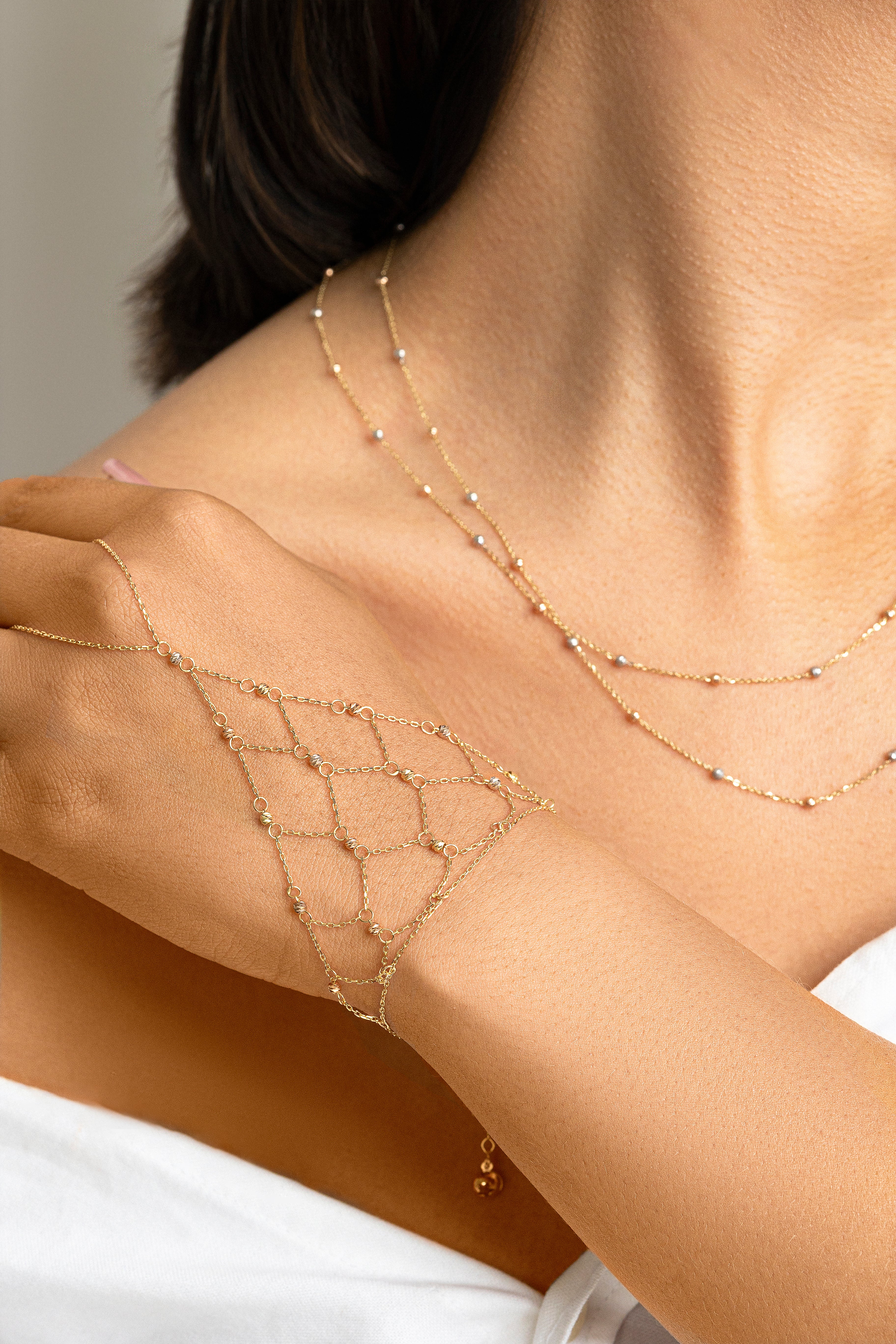 Pulso Red con Borlas Tonos en Oro de 14K